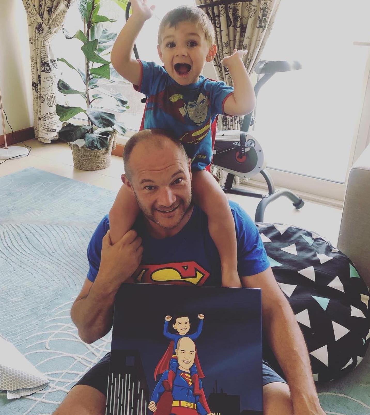 father&#39;s day gift with dad and son in super man costume as a cartoon canvas